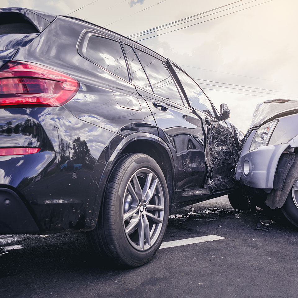 Car crash dangerous accident on the road. SUV car crashing beside another one on the road.
