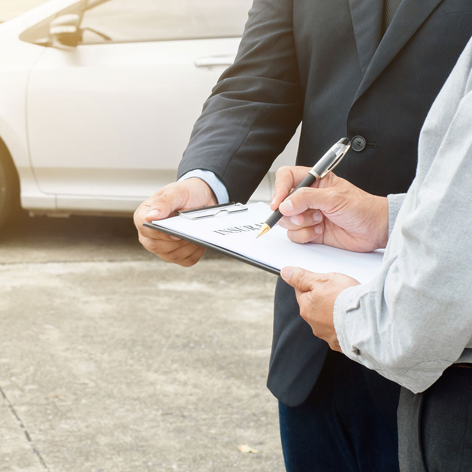 senior man and insurance agent claim process after car crash